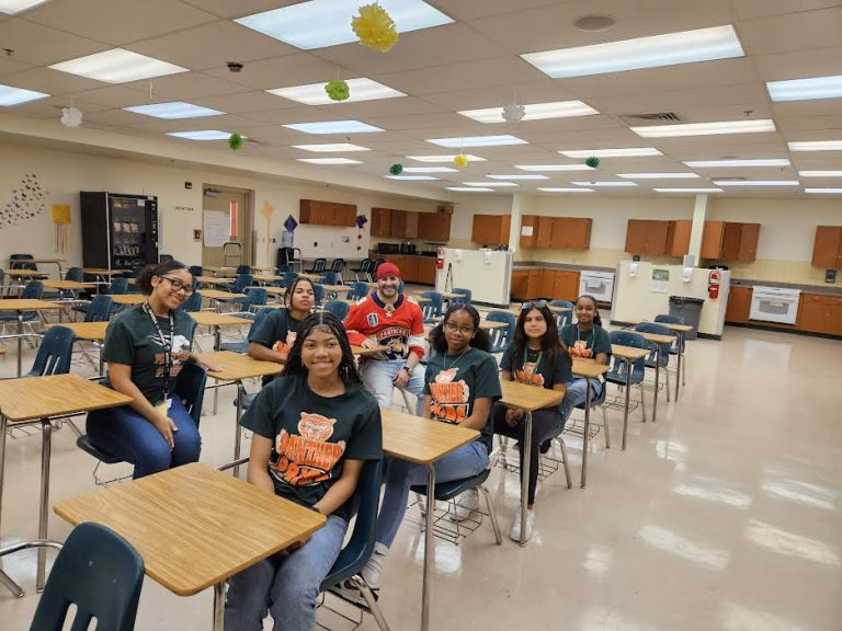 Students in Panther Pride shirts sitting at desks in a classroom